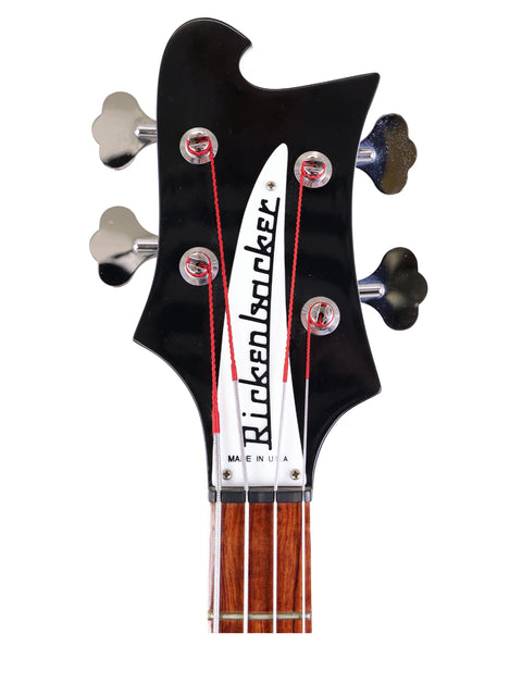 Detailed view of the headstock of a 2008 Rickenbacker 4003 Jetglo bass guitar, highlighting its unique features and finish.