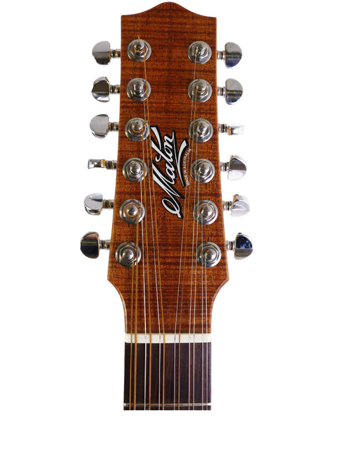 Detailed view of the headstock of a 2009 Maton EM425C 12-string acoustic guitar, highlighting its elegant features.