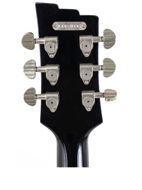 Detailed view of the headstock of a 2014 Duesenberg 49er solid body guitar, highlighting its unique features and finish.