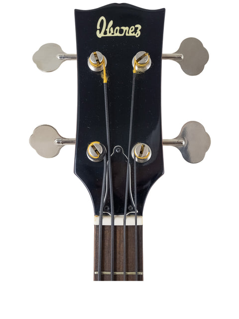 Detailed view of the headstock of an Ibanez 2403B electric guitar, highlighting its classic features from 1976.