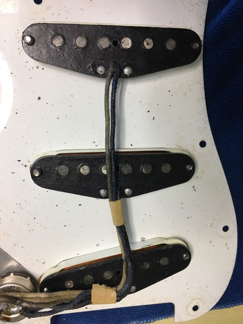 Detailed view of the neck pickup on a 1959 USA Fender Stratocaster, featuring a blond body and maple neck.