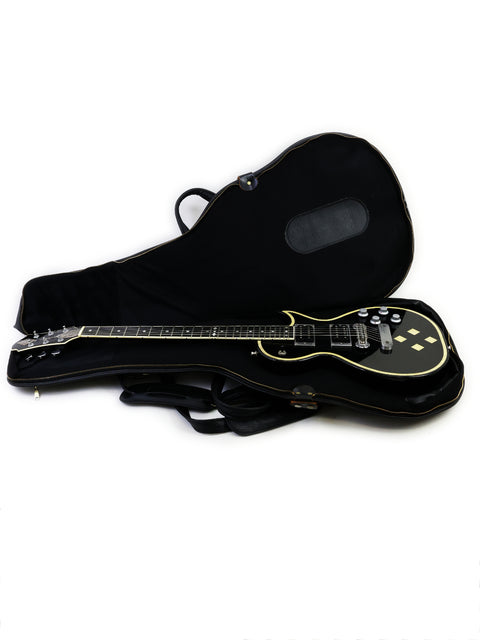 Elegant black guitar case on a white backdrop, ideal for safeguarding your vintage Greco Zemaitis GZ-2600IF from Japan, 2004.