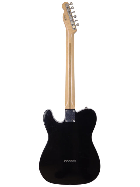 Fender Custom Shop Telecaster Thinline Closet Classic, a black electric guitar with a wooden body, USA 2005 edition.