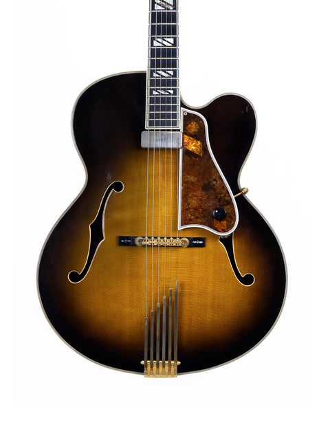 Gibson Custom Shop Le Grand Archtop guitar from 1997, featuring a stunning sunburst finish that highlights its classic style.