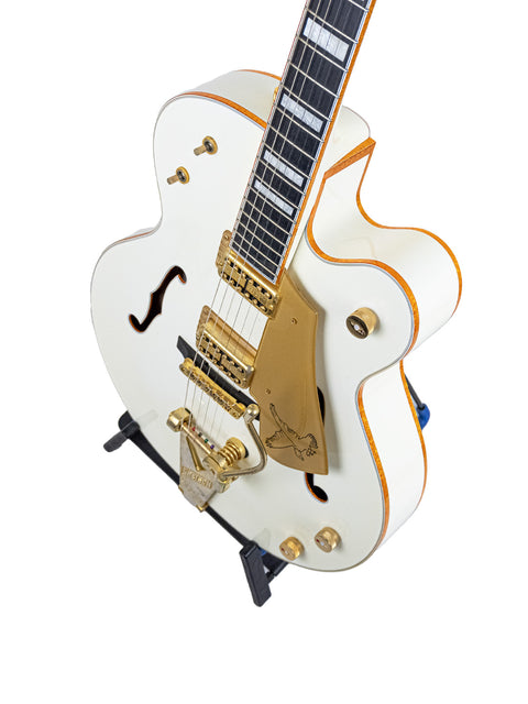 Gretsch G7593 White Falcon guitar in white, highlighted by gold hardware and a gold pickguard, crafted in Japan in 2012.