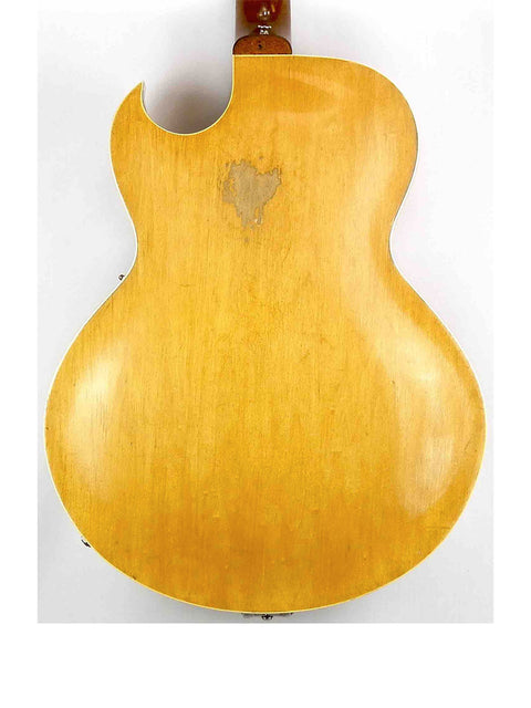 Heart-shaped cutout on the back of a vintage 1953 Gibson ES 175 DN guitar, emphasizing its unique craftsmanship.