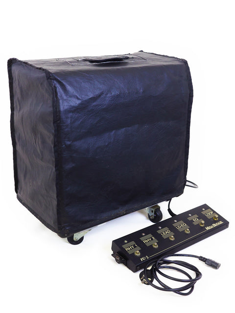 Inside a black suitcase, a power cord and a Mesa Boogie Mark IV Combo Amplifier from 2003, USA, are visible.