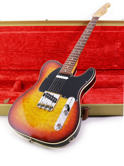 Inside a bold red case lies a Fender Custom Shop 50s Telecaster guitar, representing timeless style and American craftsmanship from 1998.