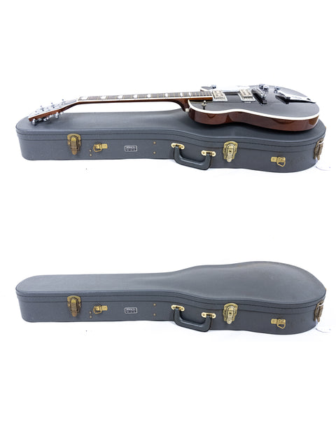 Inside a case, two guitars are visible, including a 1989 Gretsch Duo Jet 6128 from Japan.