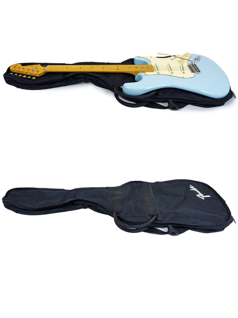 Inside a guitar case, a blue guitar and a black guitar await, highlighting the Warmoth Strat Partscaster from 2012, USA.