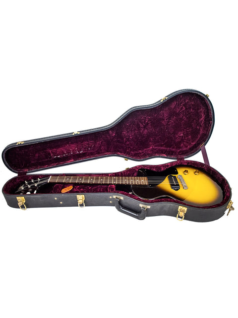 Inside a guitar case, a vibrant yellow Gibson Custom Shop '57 Les Paul Junior Reissue VOS from 2007 is prominently displayed.