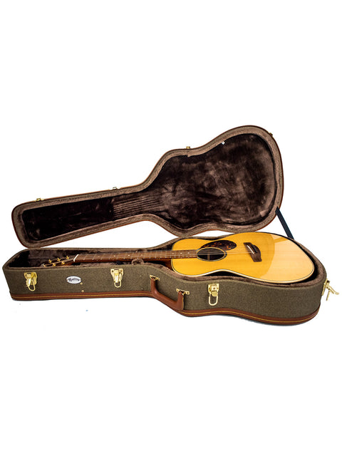 Inside a wooden guitar case rests a Gerard Gilet 000 14 Fret Acoustic guitar, made in Australia in 2005, highlighting its beauty.