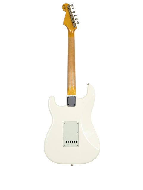 Olympic White Fender '60s Stratocaster with custom shop parts, highlighting its iconic shape and vintage appeal.