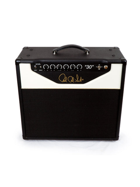 PRS Paul Reed Smith 30 Combo Amp in black and white, elegantly placed on a white surface, highlighting its classic style.