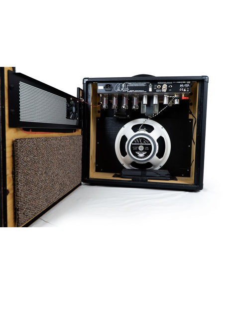 PRS Paul Reed Smith 30 Combo Amp with speaker and cabinet, showcasing a sleek design and powerful sound capabilities.