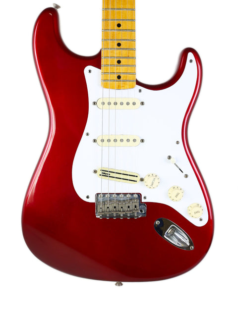 Red electric guitar with a white body, featuring the Fender Vintage Hot Rod ‘57 Stratocaster model from 2007.