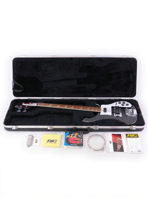 Rickenbacker 4003 Jetglo bass guitar in a protective case, complete with accessories, highlighting its classic look.
