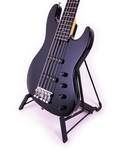Sadowsky NYC Jazz Bass 5 String guitar in black, resting on a stand with a bright white background.