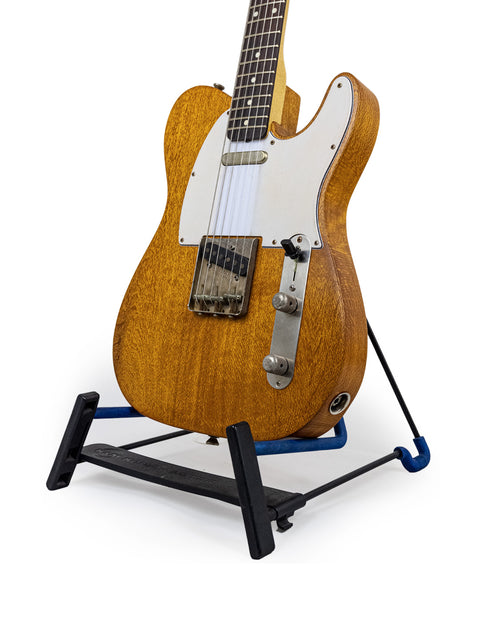 Silky Oak Txxx Style Partscaster guitar resting on a black stand, representing new design from Australia, 2021.