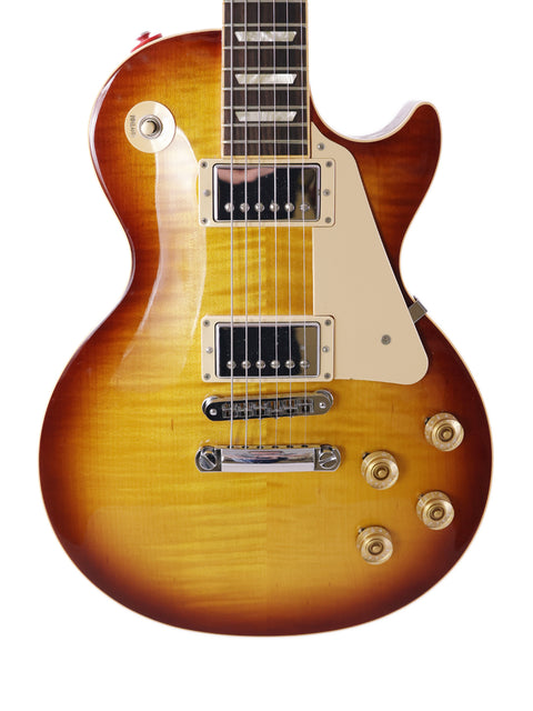 Stunning Gibson Les Paul Custom sunburst guitar, highlighting its iconic shape and quality from the USA, 2013 edition.