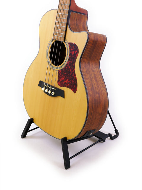 Stunning Gilman GAB10CE Acoustic Bass displayed on a stand, set against a bright white background. Ideal for your music collection.