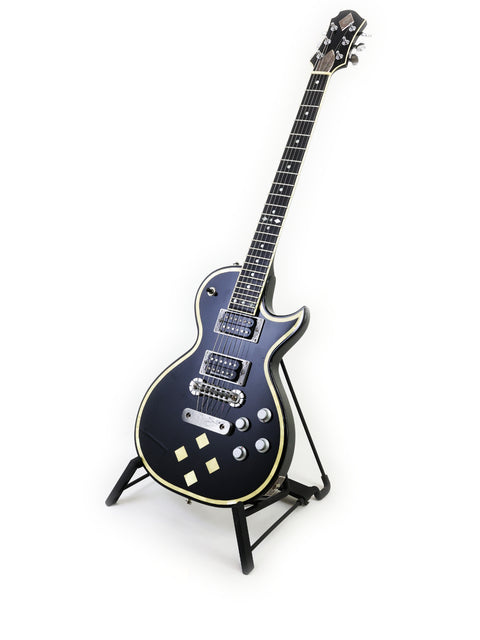 Stunning black Greco Zemaitis GZ-2600IF guitar displayed on a stand, ideal for serious guitarists and collectors.