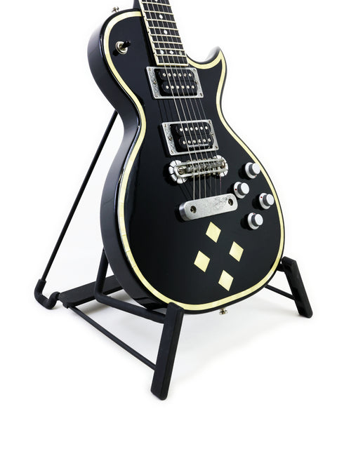 Stunning black Greco Zemaitis GZ-2600IF guitar displayed on a stand, ideal for serious guitarists and collectors alike.