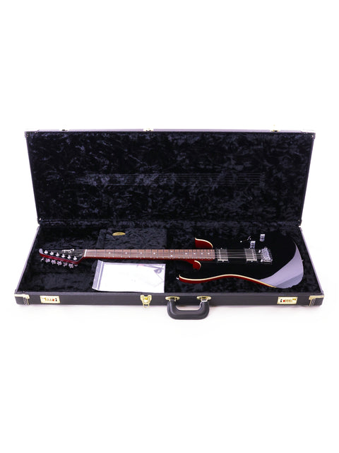 Suhr Pete Thorn Signature electric guitar in a case, featuring a sleek black design, USA model from 2021.