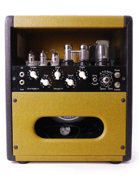 Swart Atomic Space Tone Amplifier in yellow, featuring a black and white speaker, made in the USA, 2008.