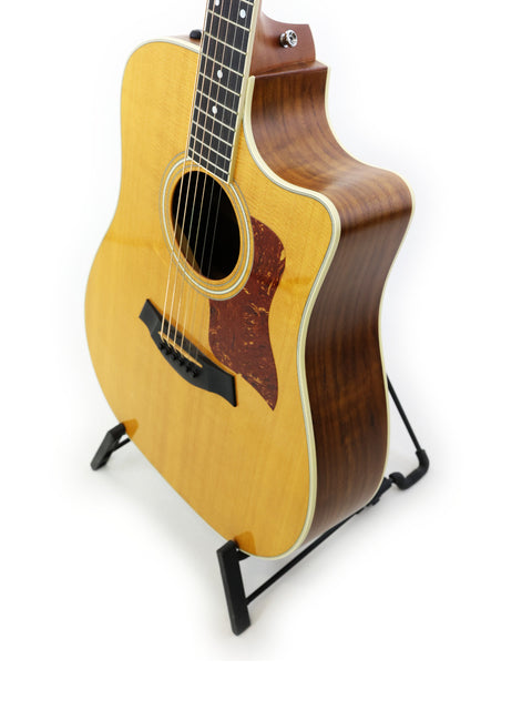 Taylor D-18CECE acoustic guitar, model 410CE, made in the USA in 2011, showcasing its elegant design and craftsmanship.