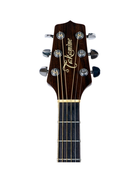 Taylor guitar on a clean white background, showcasing its features. Model: Takamine EF 360SC from Japan, 1988.