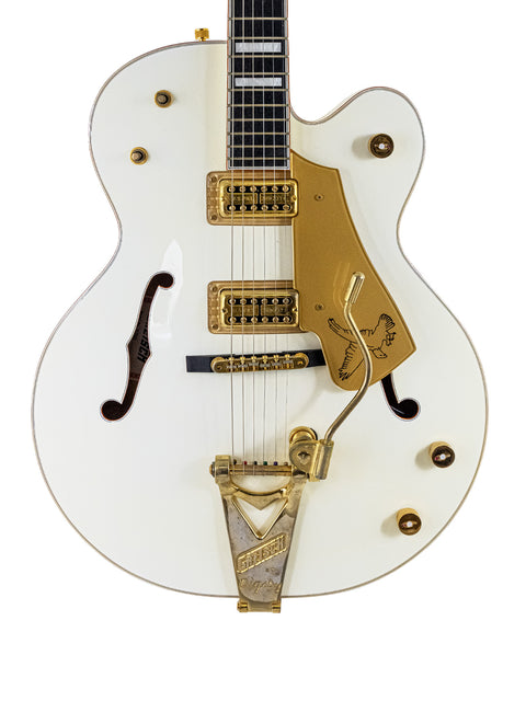 The Gretsch G-60 Deluxe in white, featuring a stunning design, identified as the G7593 White Falcon from Japan, 2012.