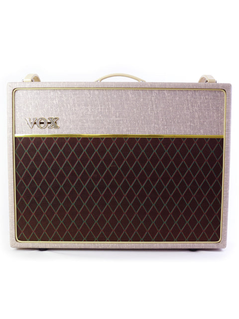 The Vox AC30HW2 combo amplifier in elegant white and gold, highlighting its vintage charm and powerful sound from 2013.