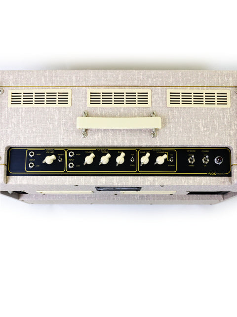 The Vox AC30 HW2X amplifier features a chic black and white aesthetic with a prominent white head, perfect for any stage.