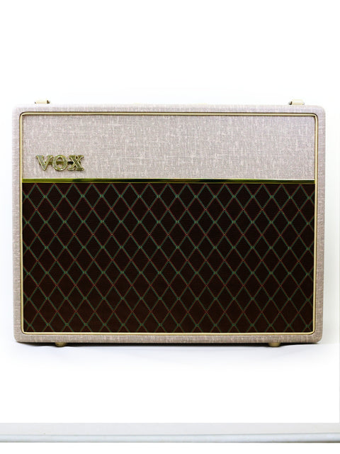 The Vox AC30 HW2X amplifier showcases a unique white and brown color scheme with an eye-catching black and white pattern.