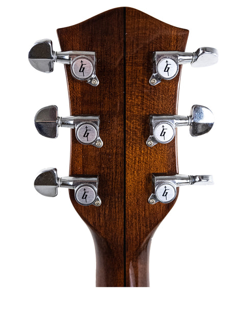 The headstock of a 1989 Gretsch Duo Jet 6128 guitar showcasing four tuning knobs.