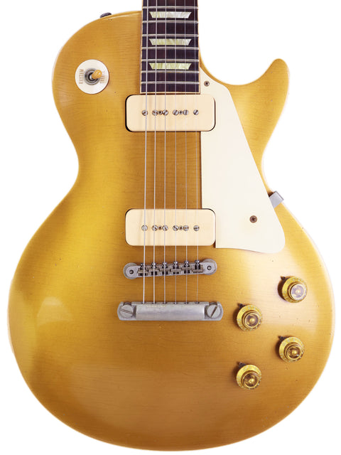 The iconic Gibson Les Paul Custom Goldtop, featuring a vintage design and modern upgrades from the 2006 Historic Reissue series.
