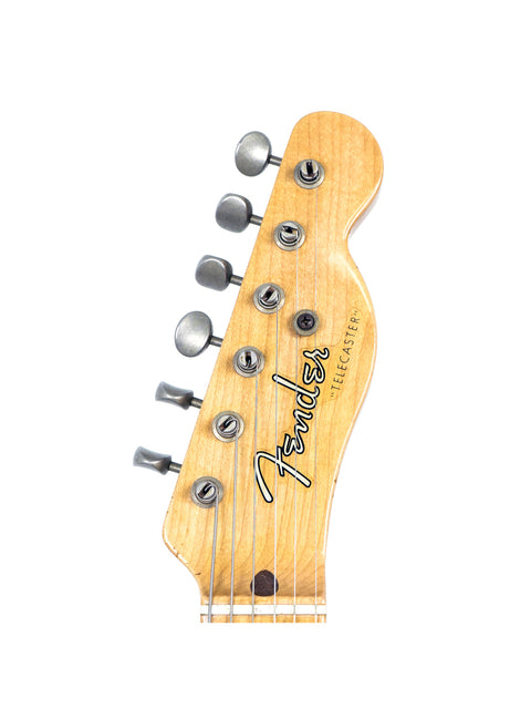 The image features a Fender American Standard Stratocaster, highlighting its iconic shape and craftsmanship, ideal for guitarists.