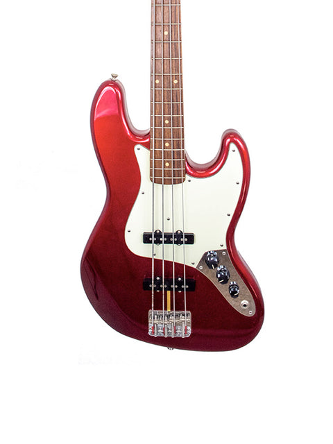 The image features a striking red Fender Custom Shop ‘62 Jazz Bass Reissue guitar set on a plain white background.
