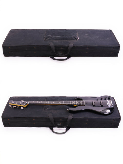 Two black bass guitars displayed in a case, highlighting a Sadowsky NYC Jazz Bass 5 String from the USA, 2000, on white.