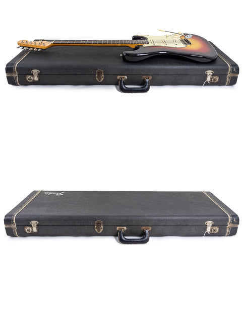 Two guitar cases on a white background, featuring a vintage 1964 Fender L Series Stratocaster in Fiesta Red.