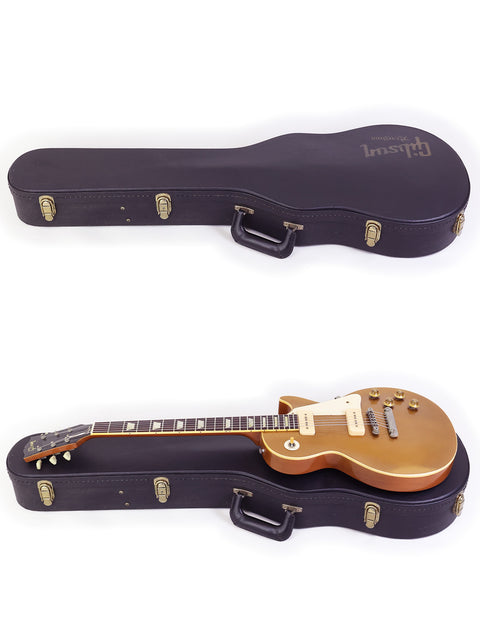 Two guitars adorned with gold hardware, accompanied by a case, including a 2006 Gibson Custom Shop Les Paul 1956 Reissue.
