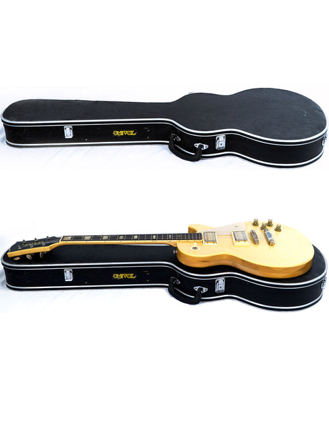 Two guitars alongside their cases on a white surface, showcasing the Univox Gimmie U-1988 from Japan, 1974-75.