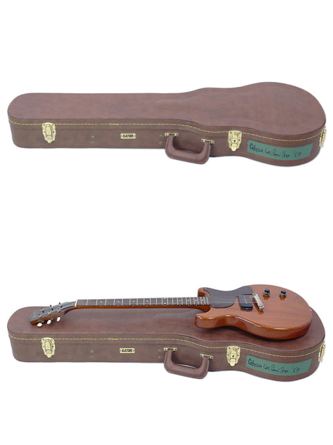 Two guitars, featuring a 1959 Gibson Les Paul Jr, securely placed in a wooden case.