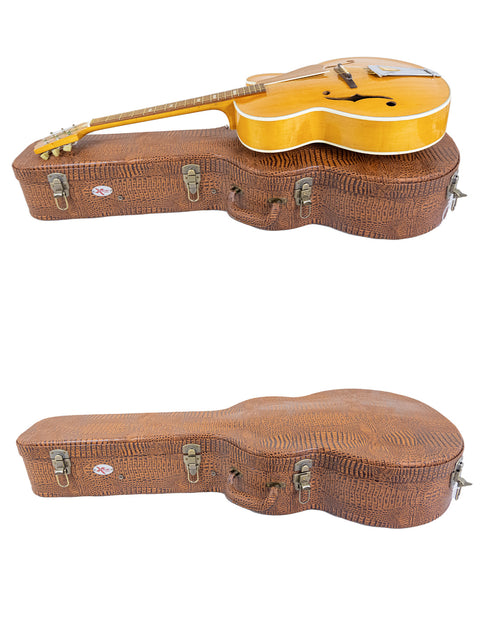 Two guitars nestled in a case, topped by a 1970s Sutton Archtop, highlighting vintage craftsmanship.