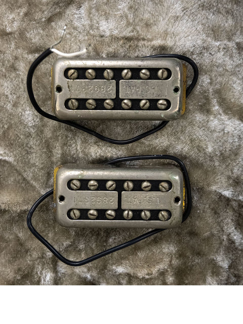 Two humbuckers with silver covers set against a white background, showcasing the 1989 Gretsch Duo Jet 6128 from Japan.