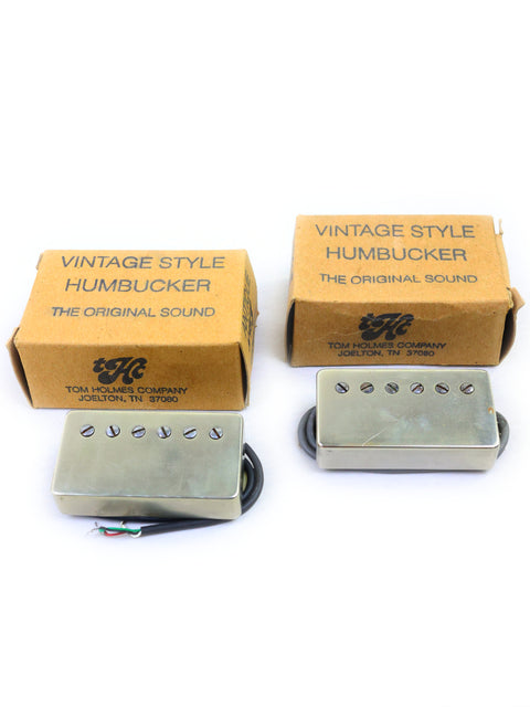 Two vintage-style humbuckers in boxes, featuring the Tom Holmes H450/H455 Pickups Set from the USA.