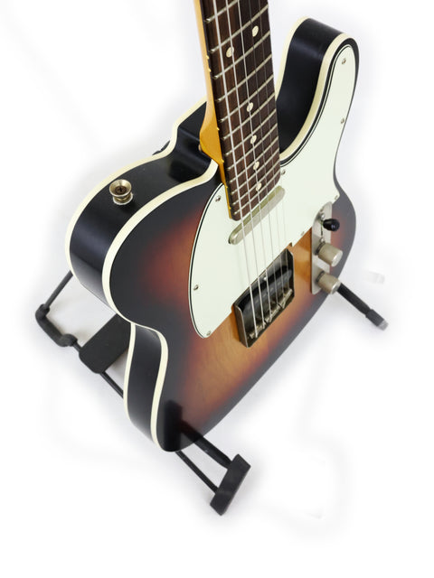 Txxx Custom Style Partscaster guitar in sunburst, featuring a black body and a classic white pick guard.