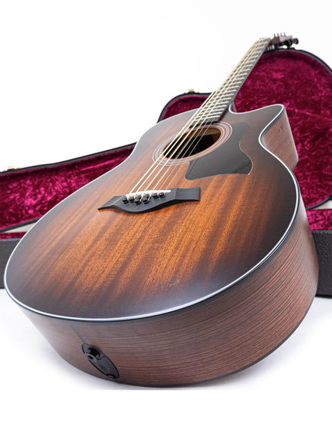 USA-made Taylor 326 CE Baritone 8 LTD acoustic guitar, known for its beautiful craftsmanship and powerful sound.