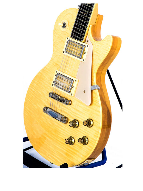 Univox Gimmie U-1988 electric guitar in yellow, Japan 1974-75, prominently positioned on a stand for display.